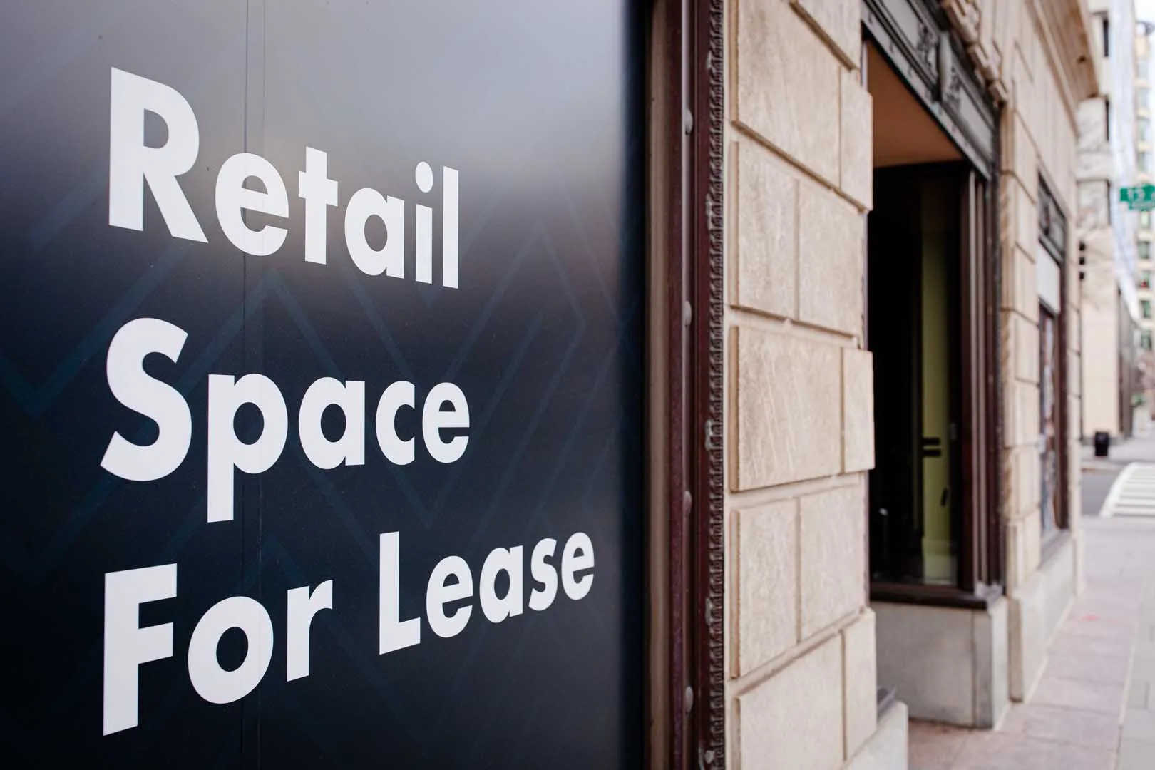 Retail,Space,For,Lease,Sign,On,Display,Outside,A,Building,